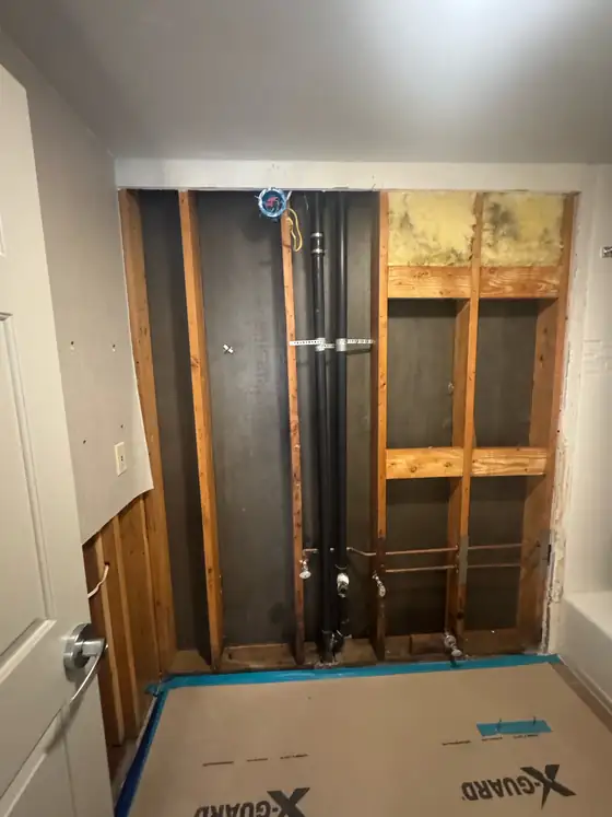 New framing and plumbing in place in the opened wall