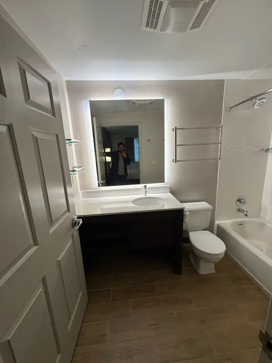 The completed bathroom looking toward the tub and shower