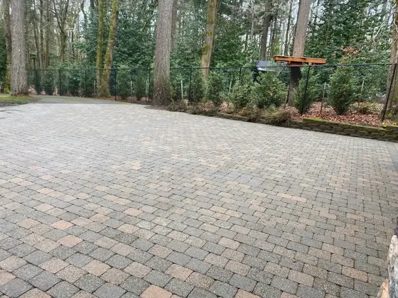 Restored paver driveway, evenly coloured again after pressure washing