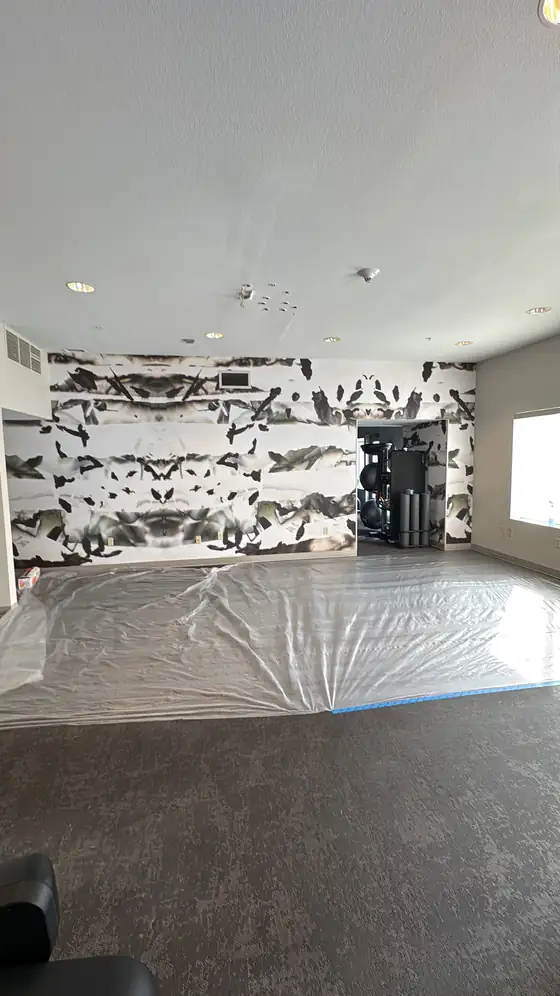 Floor protection down across the gym before the ceiling work