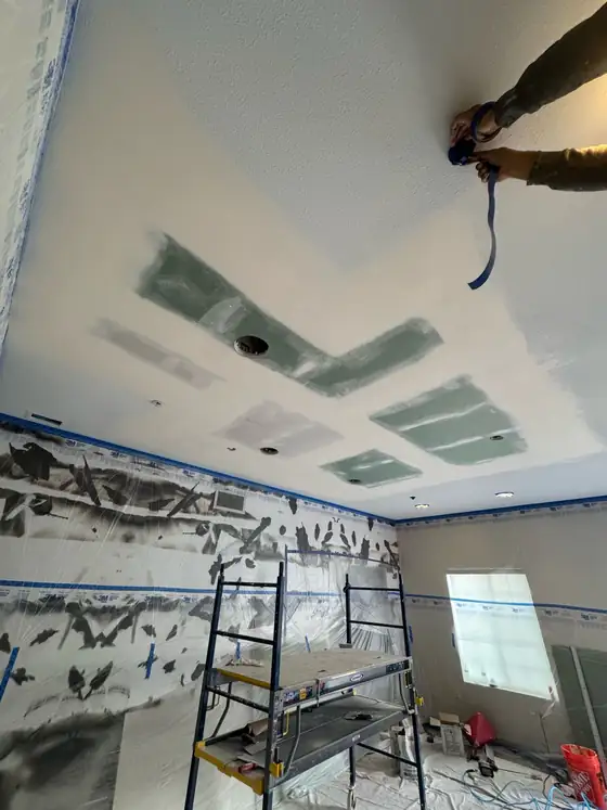 Sanding and finishing the new ceiling