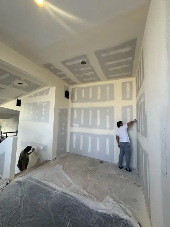 Painting the walls once the drywall was finished