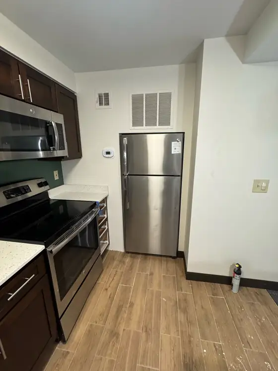 The kitchen with the new refrigerator set in place