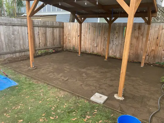 Compacted base laid under the patio cover, ready for pavers
