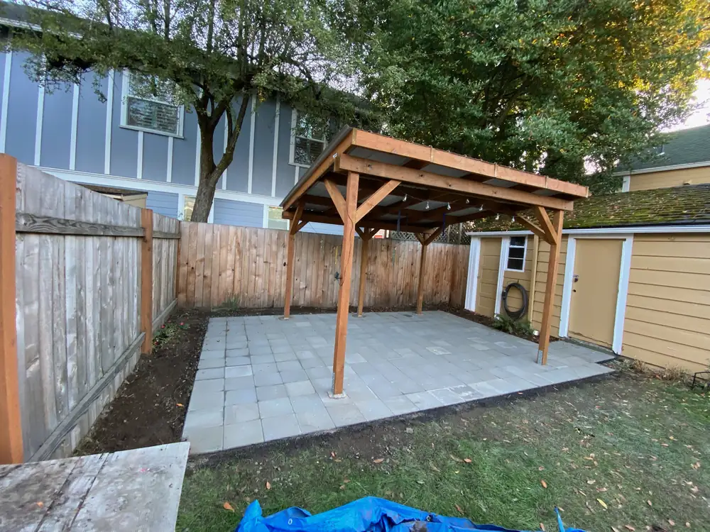 Finished cedar patio cover and paver patio in a Portland back garden