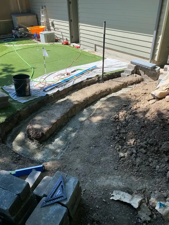 Trench dug out for the curved retaining wall footing