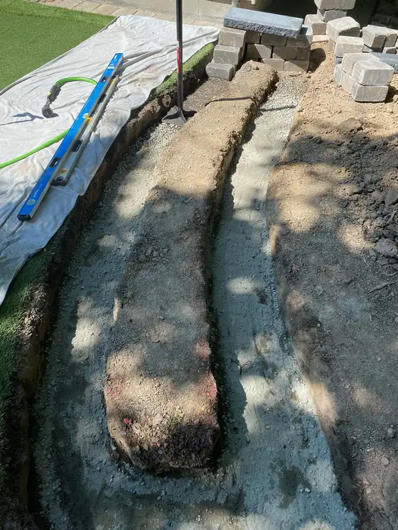 Base course of the curved block wall going in