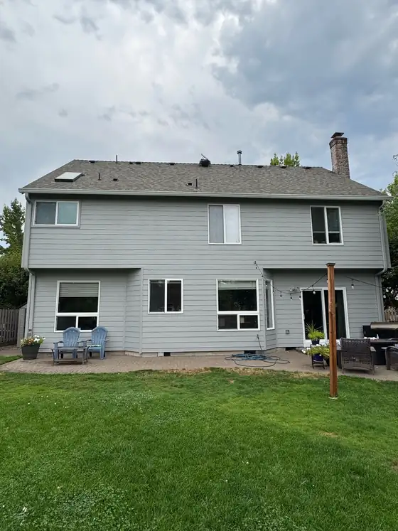 The finished rear elevation after new siding and paint